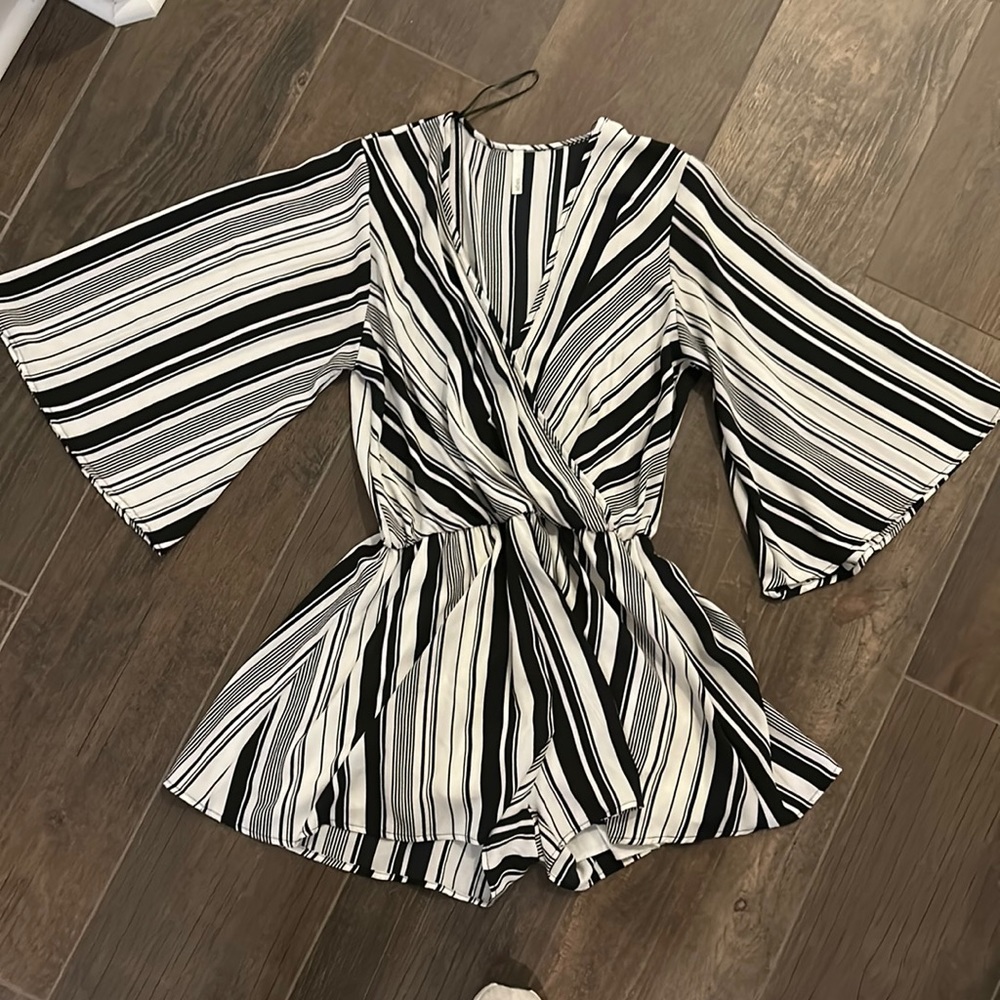 Great romper…. Like new.  Dress up or down. 3/4 sleeve